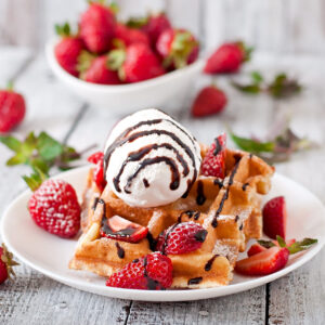 belgium-waffles-with-strawberries-ice-cream-white-plate