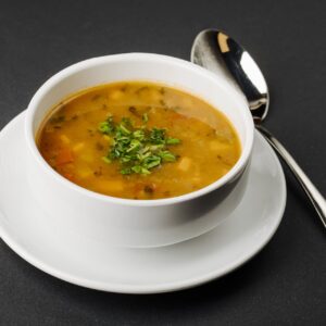 lentil-soup-with-mixed-ingredients-herbs-white-bowl-with-spoon